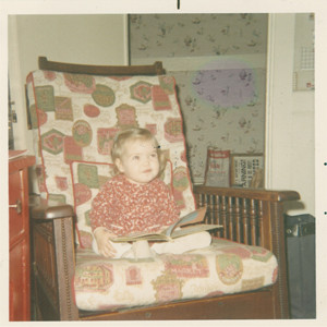 Me, reading and pondering, age 2.